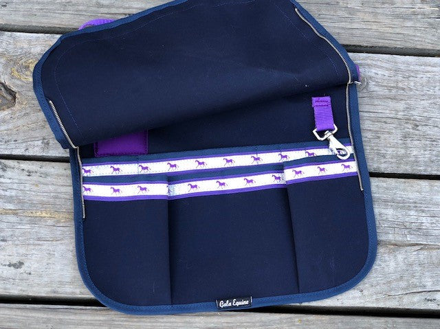 This is the apron with the zippers open. This will be the colour on this item. Navy with Purple Trims in a canvas fabric